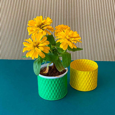 Daily Dump cylinder pot 4inches diameter green and yellow with flowers